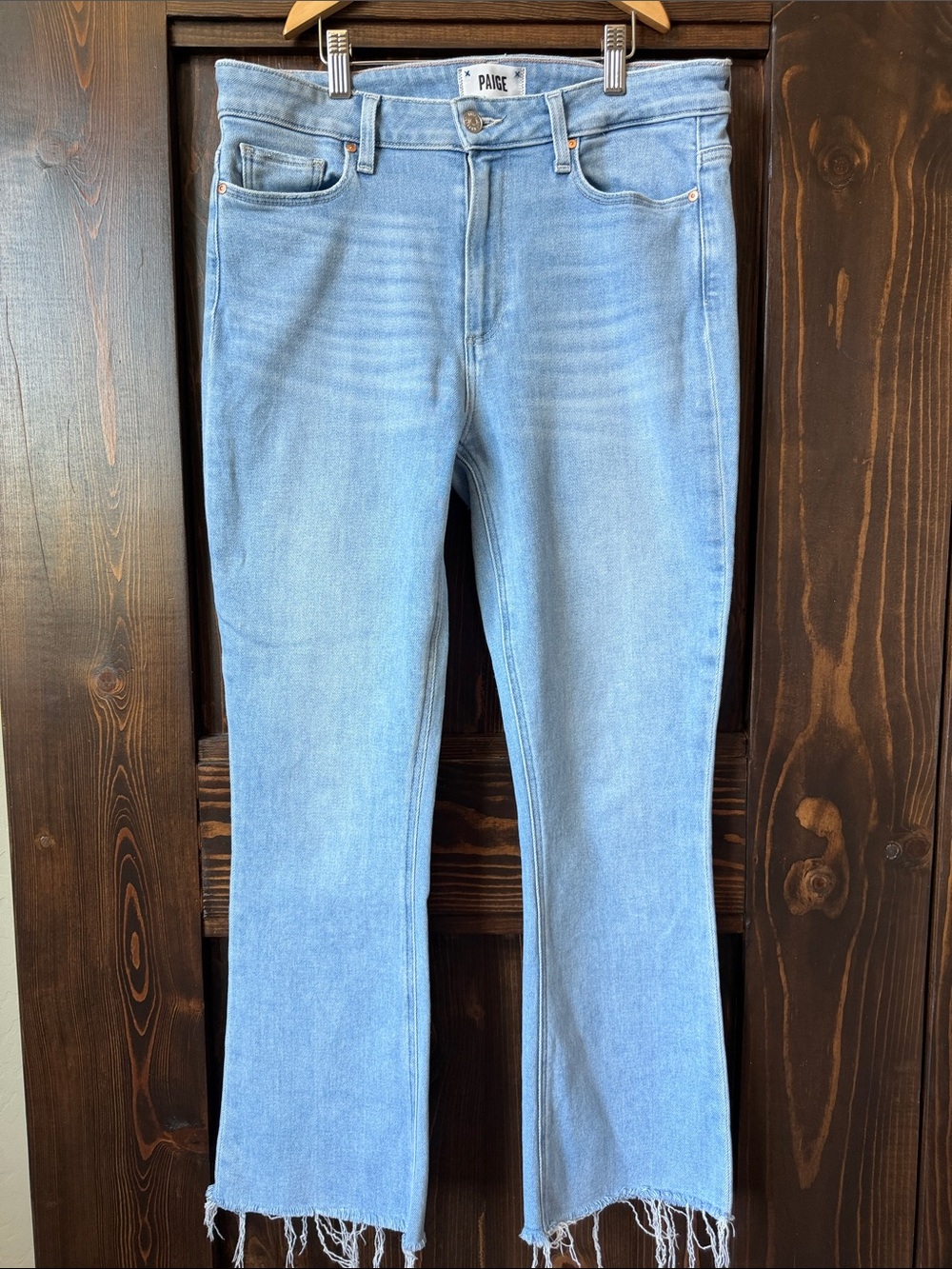 PAIGE Light Wash Flare Jeans with Raw Hem